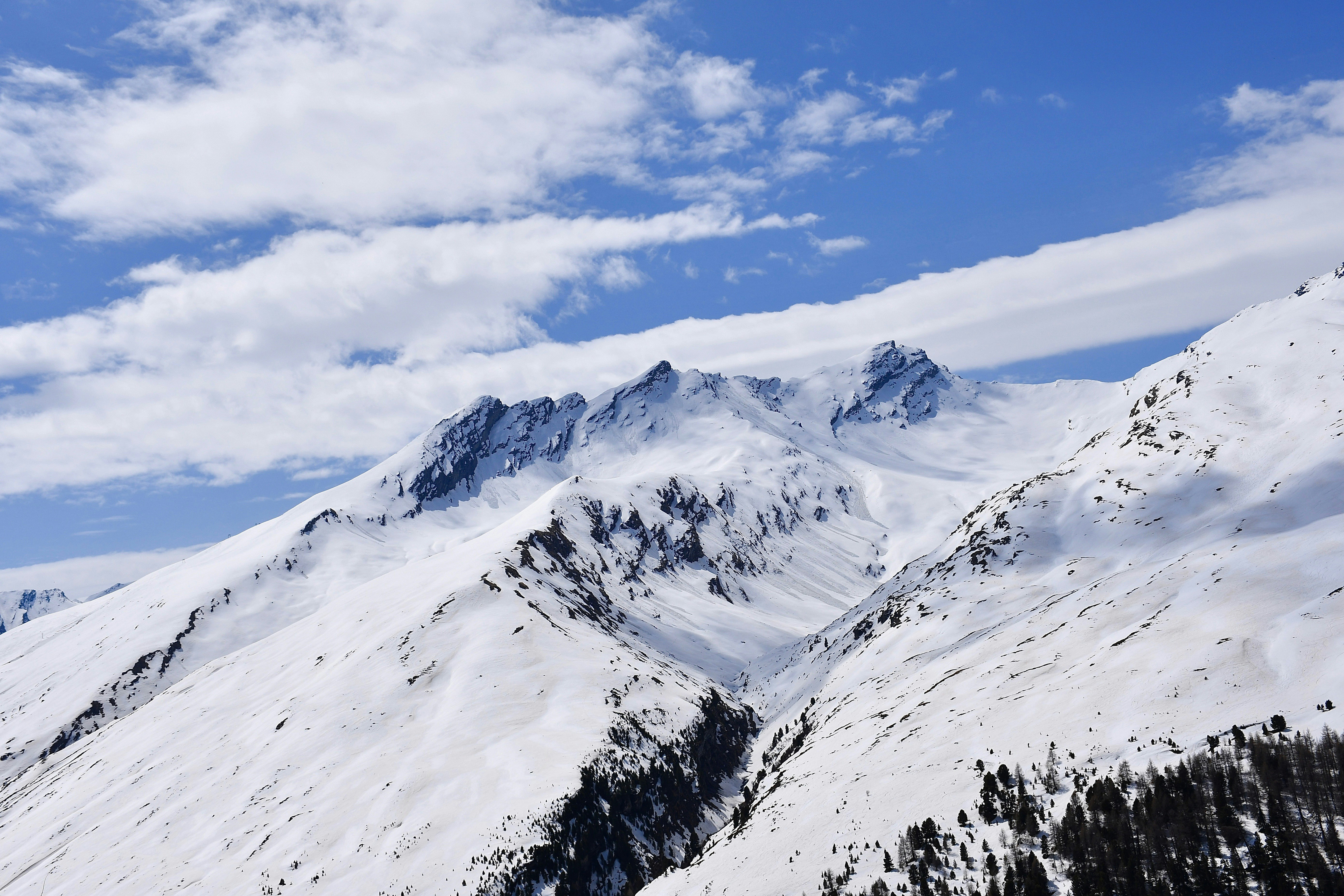 snow covered mountain under blue sky during daytime